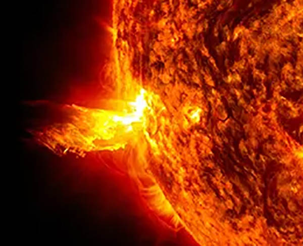 NASA spacecraft image of the Sun showing both a solar flare (a bright flash of high-energy light 
				on the Sun) and a coronal mass ejection (the solar material blasting out into space). Image credit: NASA/SDO