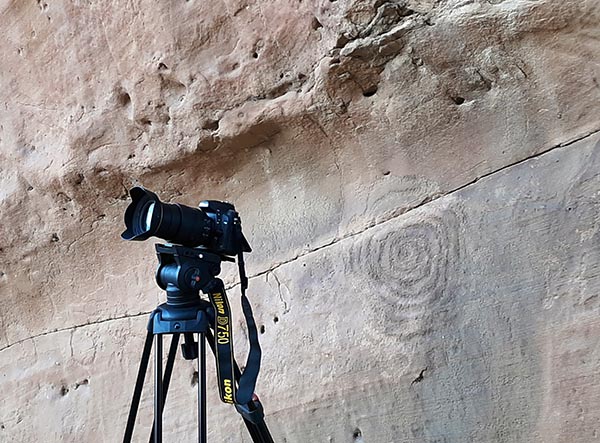Camera aligned with the center of the spiral-like petroglyph 
			on the northeastern facet of a Chaco Sun-watching site. (credit: Mobile phone photo by C. Morrow - 20 June 2021)